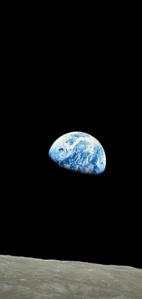 This live phone wallpaper showcases the Earth as seen from the Moon, with a black background that emphasizes its vivid colors