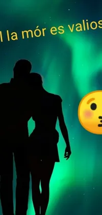 This stunning phone live wallpaper captures a happy couple standing in front of a breathtaking northern lights backdrop