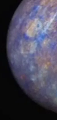 This unique phone live wallpaper features a close-up view of a planet on a black background, stunning microscopic photography, and vibrant multi-colored lapis