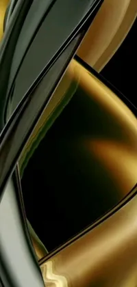 This live wallpaper for mobile devices features a sleek black and gold vase with an abstract sculpture