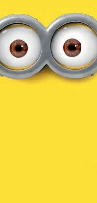 This lively phone wallpaper features a cute minion with expressive eyes set against a vibrant yellow background